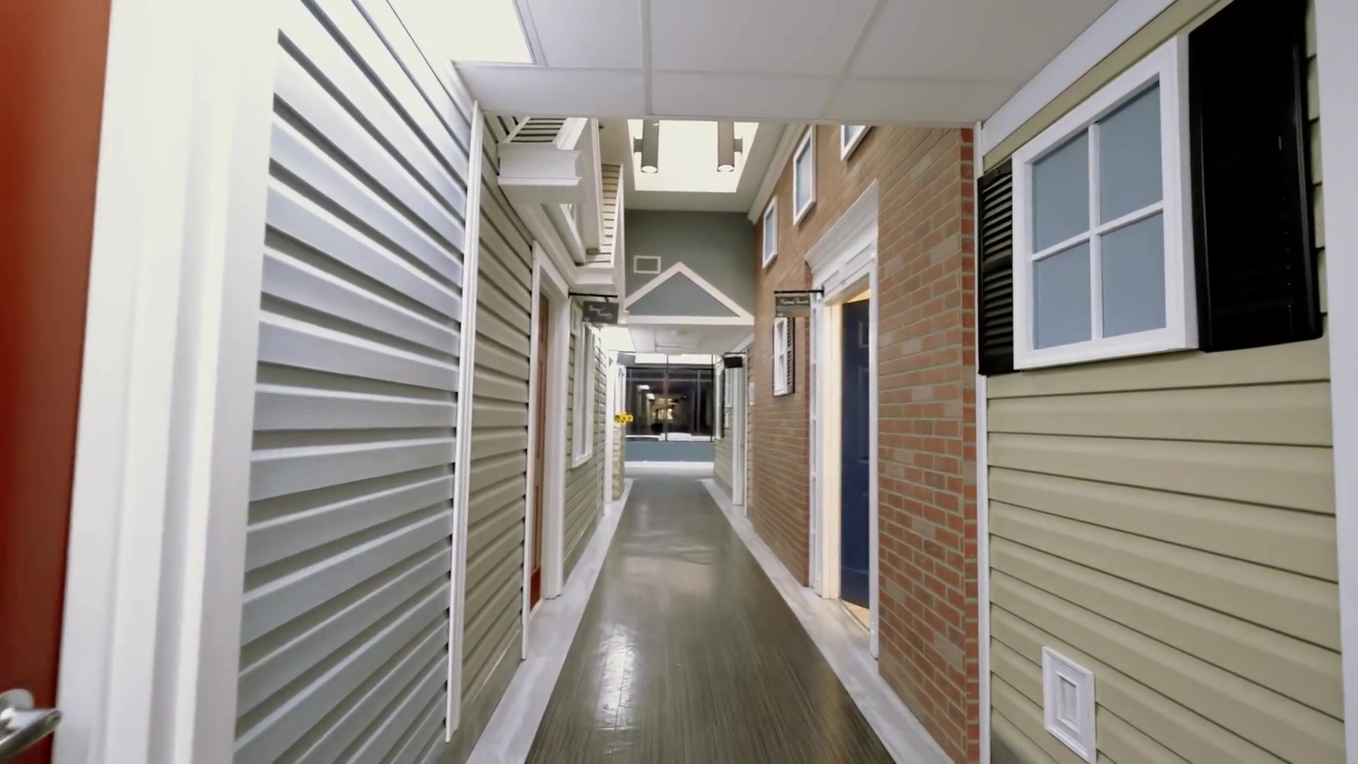 Indoor neighborhood-style hallways — Colonial Gardens Residences Lauderhill FL